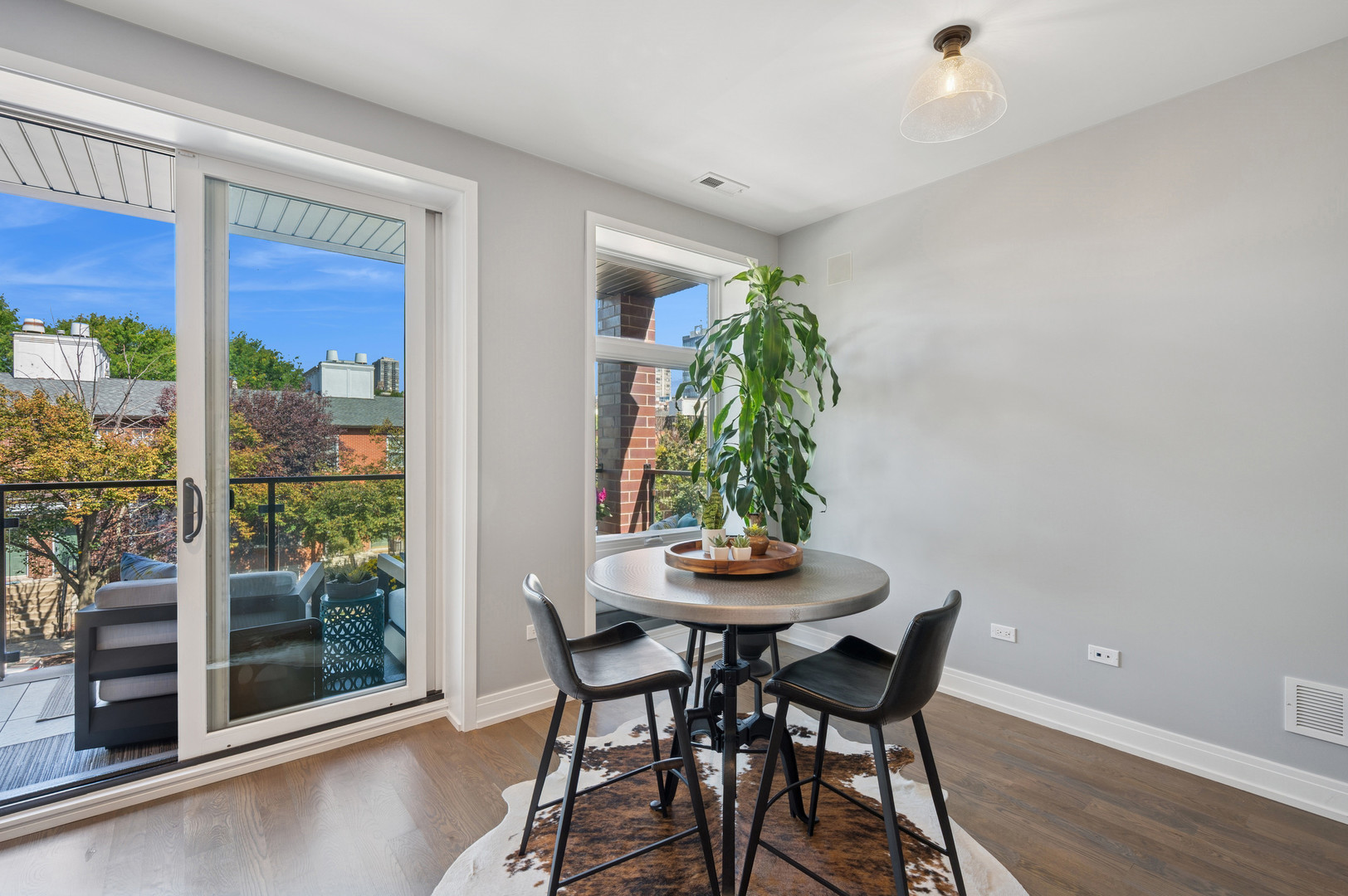 231 West Scott Street, Unit 2 Chicago, IL 60610 - Photo 12 of 33 a view of a dining room with furniture and a potted plant