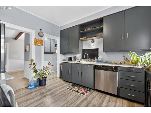 a kitchen view of a refrigerator stove and oven