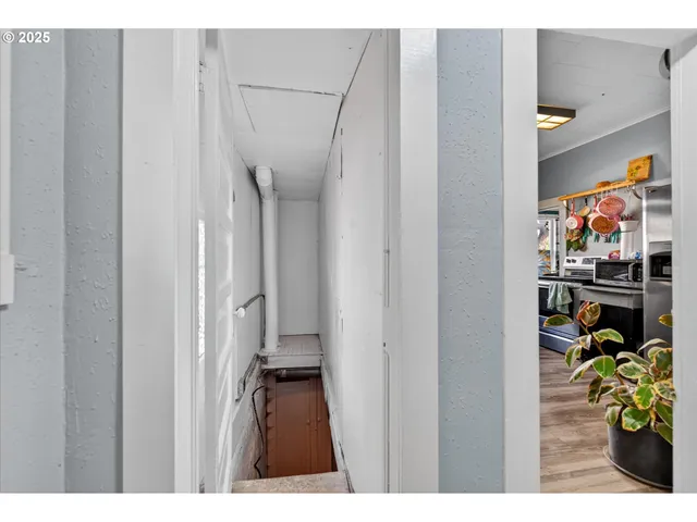 a bedroom with a bed and a view of bedroom