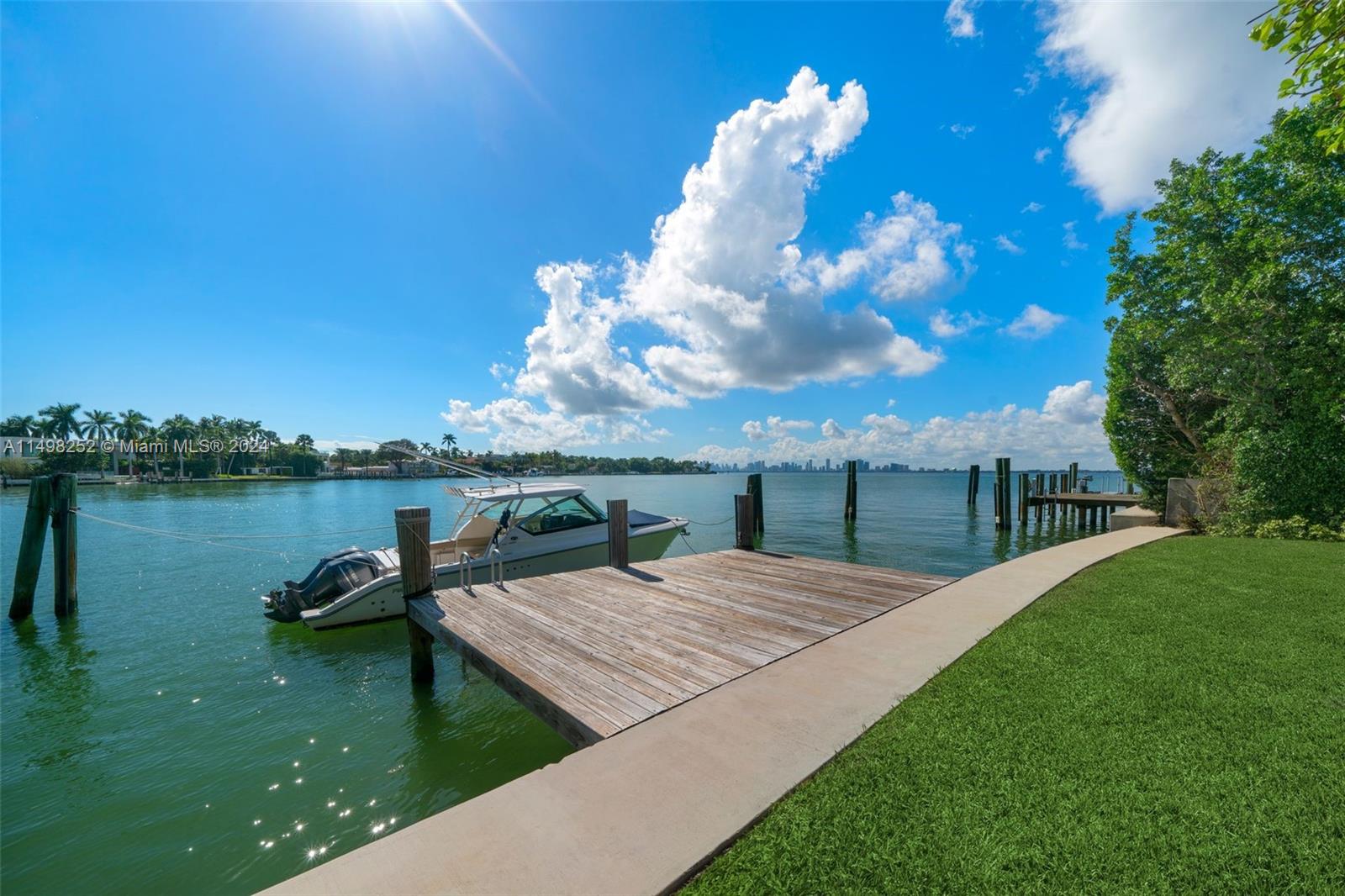 12 Lagorce Circle Miami Beach, FL 33141 - Photo 15 of 23 a view of a lake with a yard