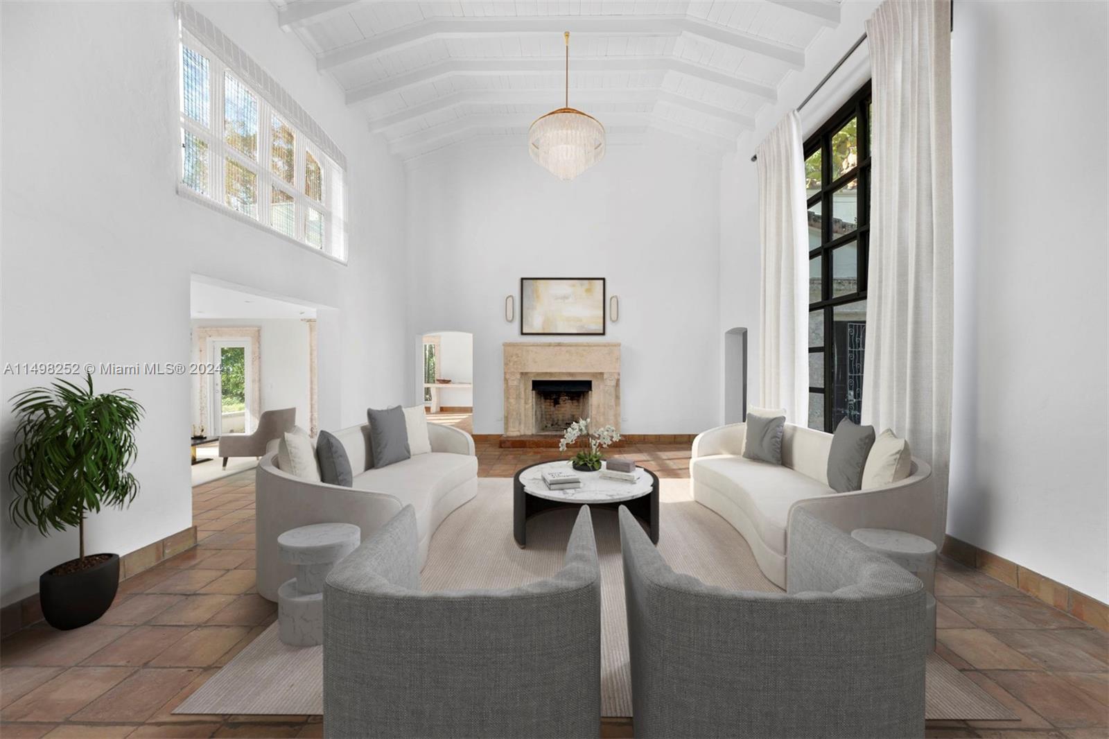 12 Lagorce Circle Miami Beach, FL 33141 - Photo 2 of 23 a living room with furniture potted plant and a fireplace