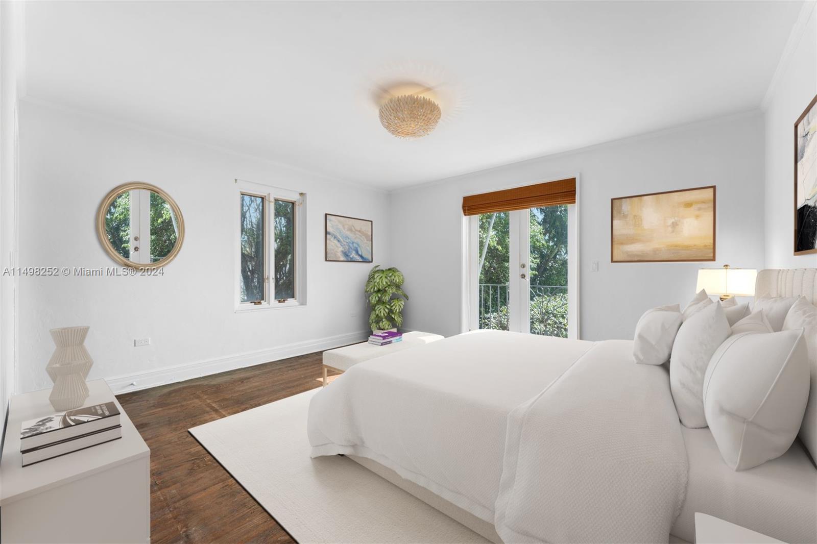 12 Lagorce Circle Miami Beach, FL 33141 - Photo 7 of 23 a bedroom with a bed and a window