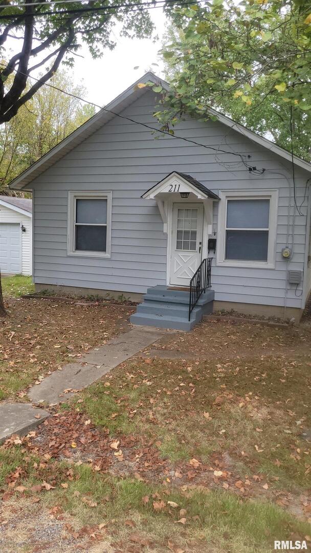 211 West Bryan Street Herrin, IL 62948 - Photo 1 of 14 a view of a house with a yard