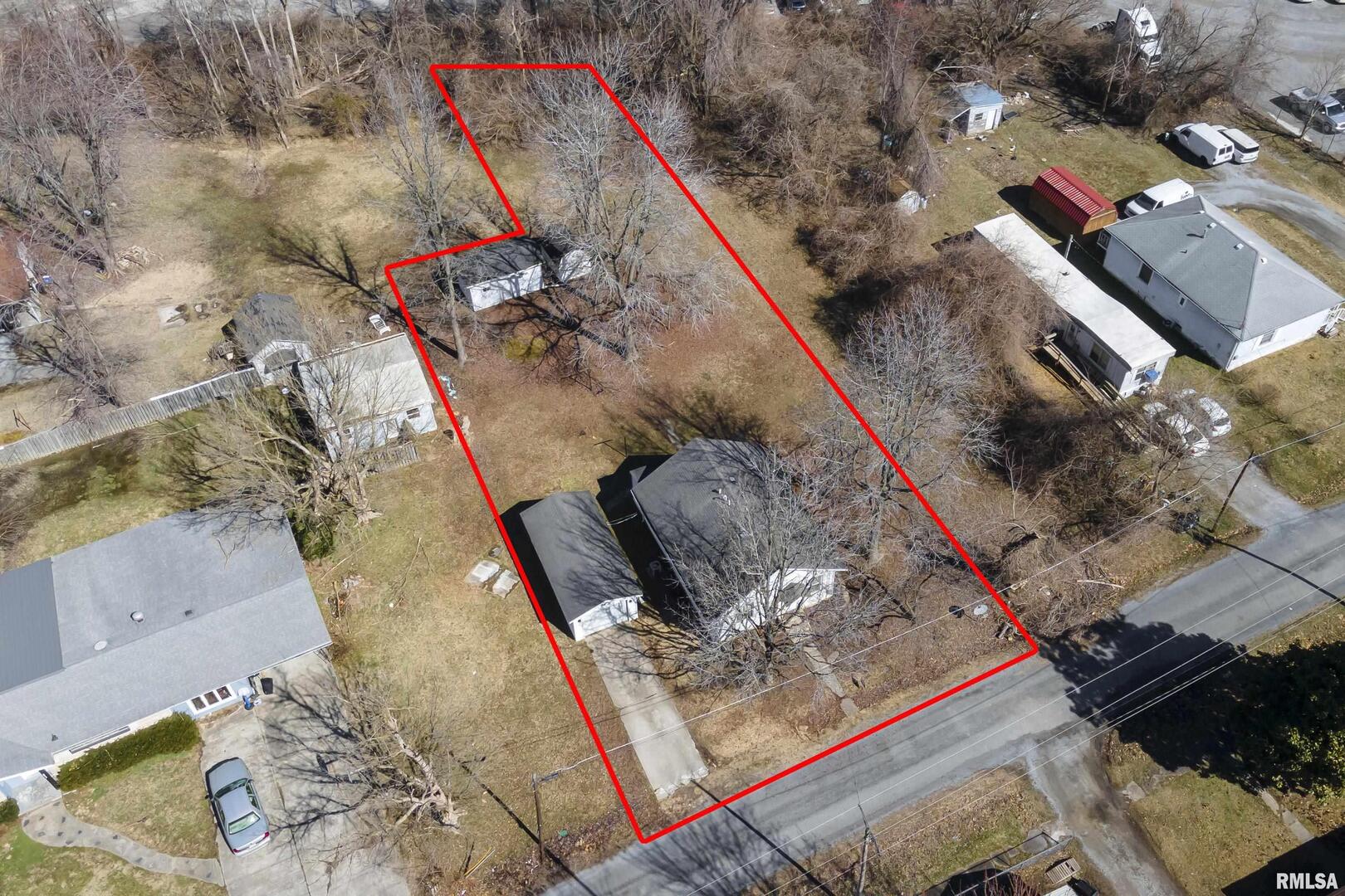 211 West Bryan Street Herrin, IL 62948 - Photo 2 of 14 an aerial view of a house with a yard