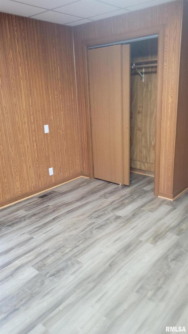 211 West Bryan Street Herrin, IL 62948 - Photo 7 of 14 a view of an empty room with wooden floor