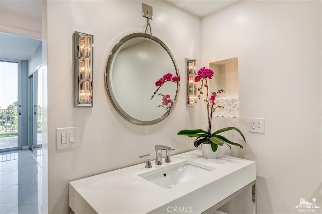 900 Island Drive, Unit 705 Rancho Mirage, CA 92270 - Photo 14 of 25 a bathroom with a sink and a mirror