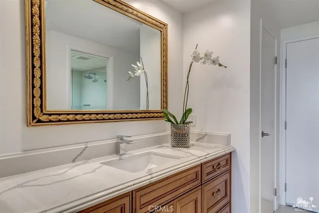a bathroom with a sink and a mirror