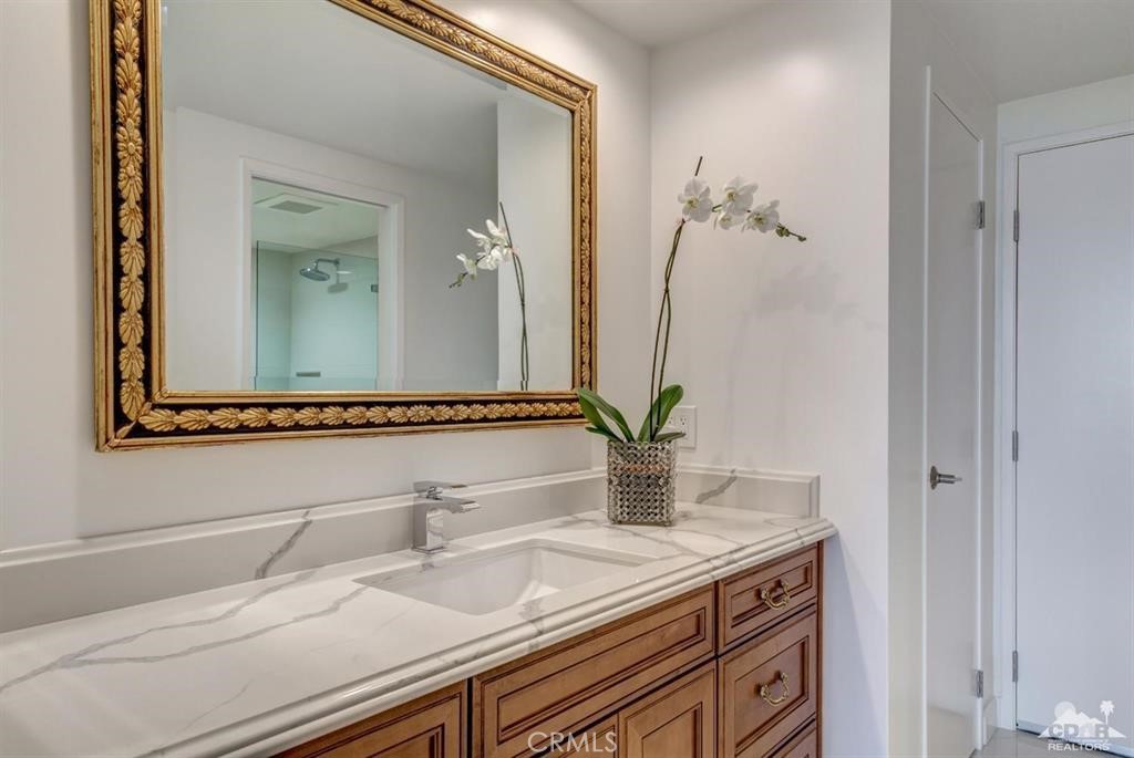 900 Island Drive, Unit 705 Rancho Mirage, CA 92270 - Photo 18 of 25 a bathroom with a sink and a mirror