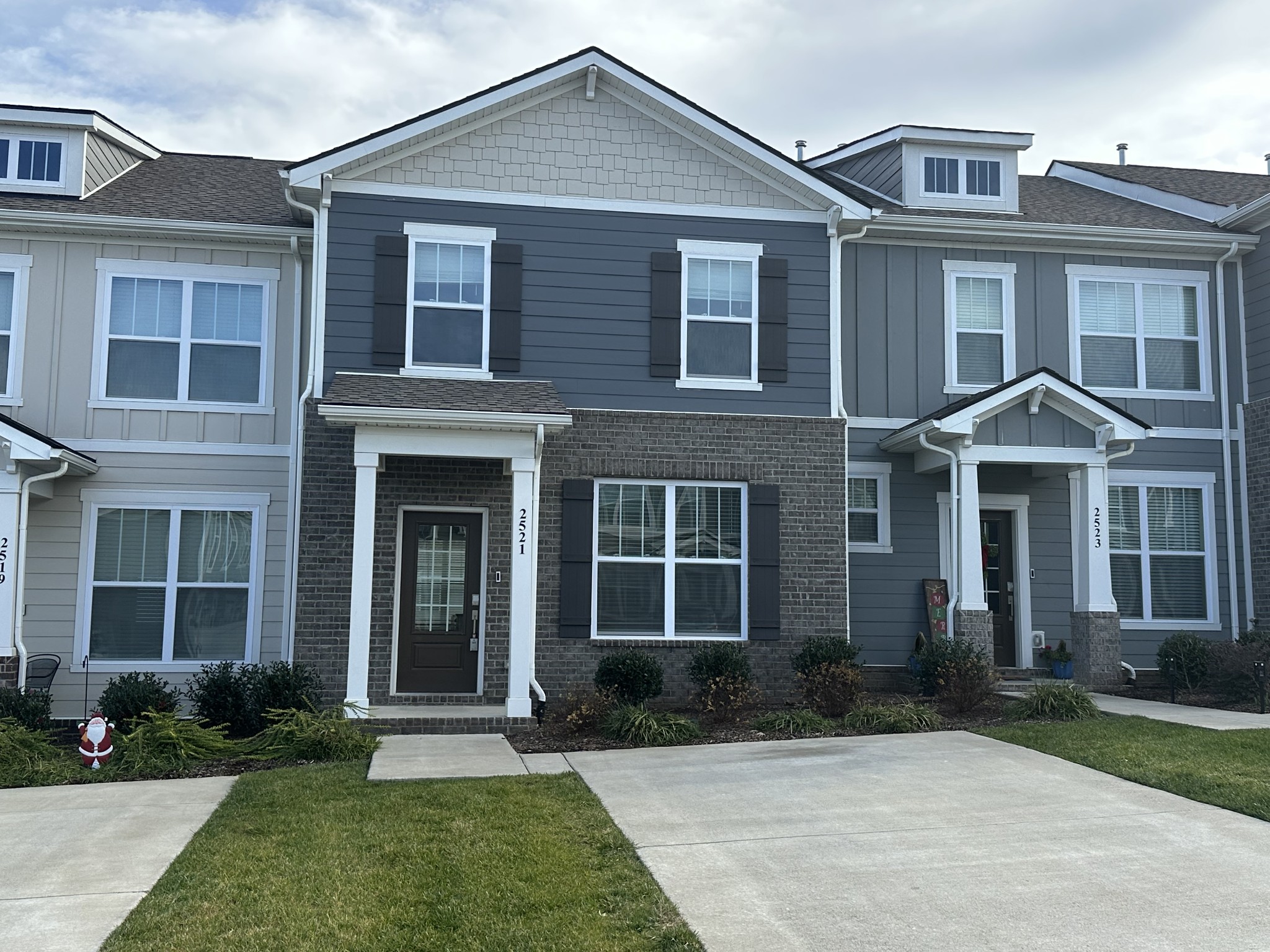 a front view of a house with a yard