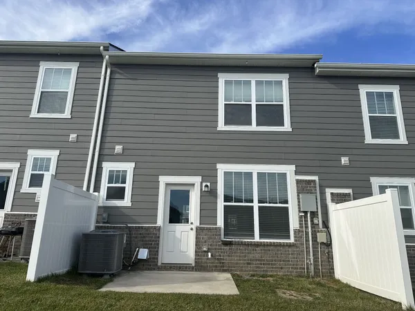 a front view of a house with stairs