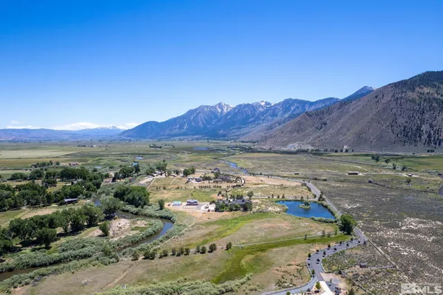 a view of a town with mountains in the background