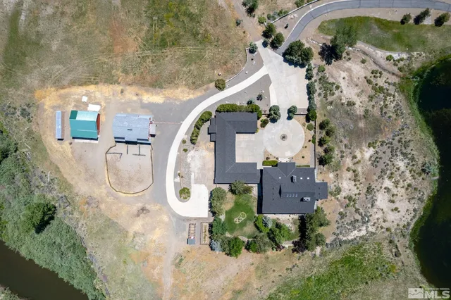 an aerial view of house with a swimming pool