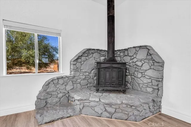 a view of a kitchen with wooden floor and a kitchen