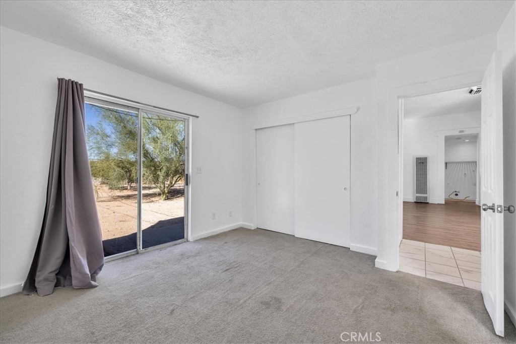 6686 Mojave Avenue Twentynine Palms, CA 92277 - Photo 20 of 41 a view of empty room with front door