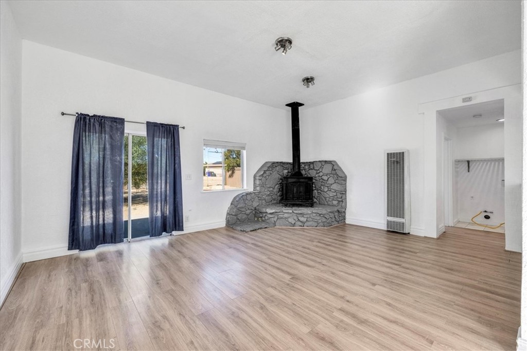 6686 Mojave Avenue Twentynine Palms, CA 92277 - Photo 7 of 41 a view of empty room with wooden floor