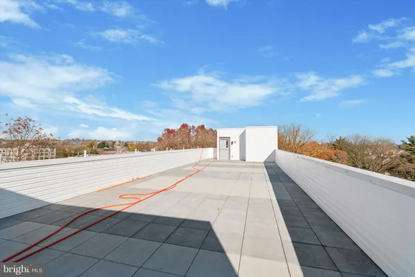 a view of roof and with city view
