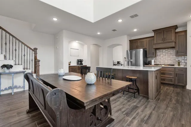 a kitchen with sink and view of living room