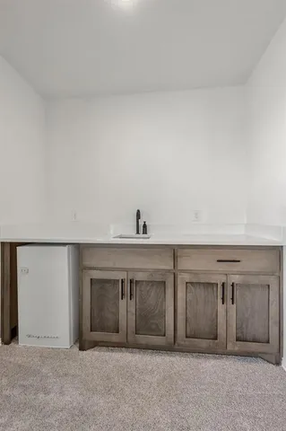 a living room with furniture and a ceiling fan
