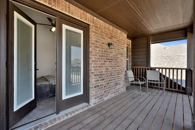 a bedroom with a bed and chair