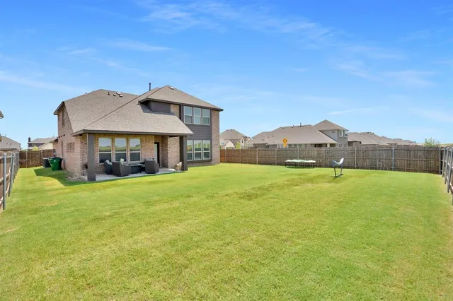 a view of balcony with wooden floor and furniture