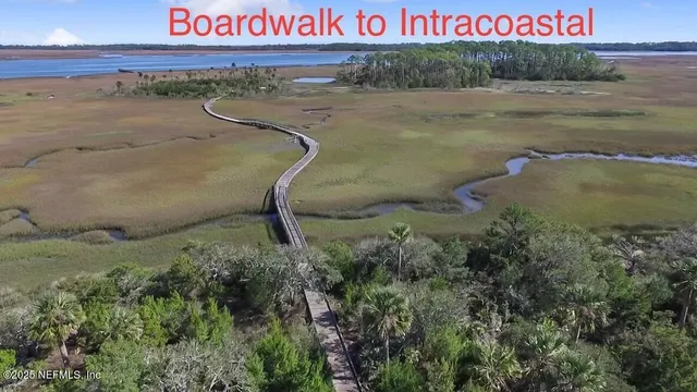 a signage on a wall next to a road