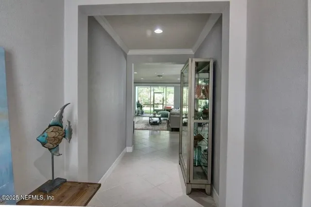 a view of hallway with livingroom and furniture