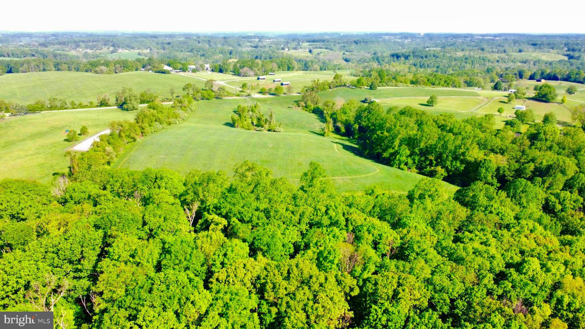 2295 Hilltop View Road Coatesville, PA 19320 - Photo 6 of 11 a view of a lush green forest with trees and some houses