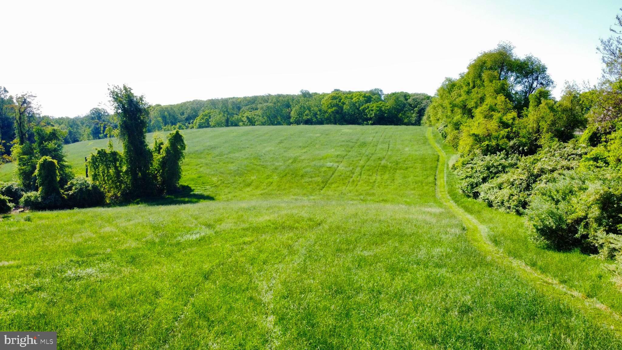 2295 Hilltop View Road Coatesville, PA 19320 - Photo 9 of 11 a view of lush green field