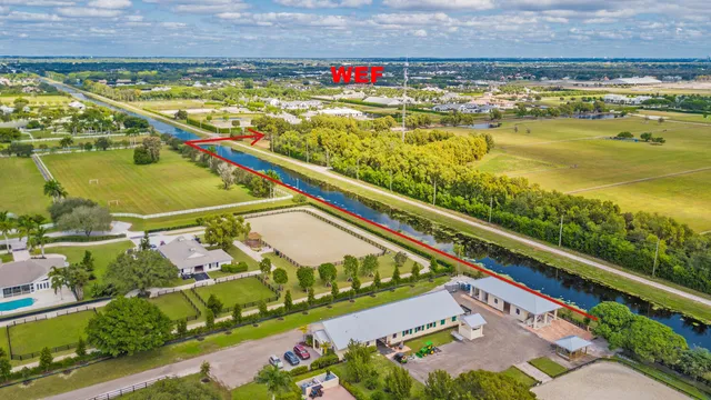 a view of swimming pool with a garden and seating area