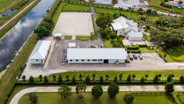 an aerial view of house with yard swimming pool and outdoor seating