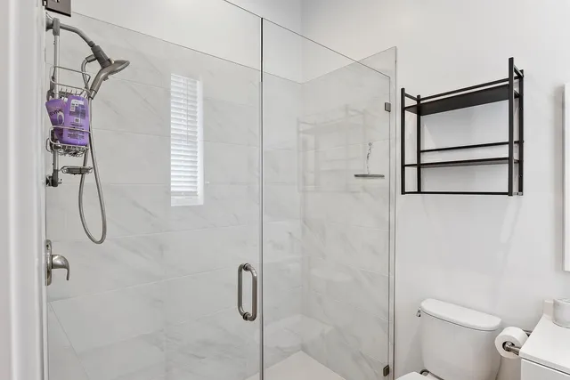 a bathroom that has a shower toilet and sink