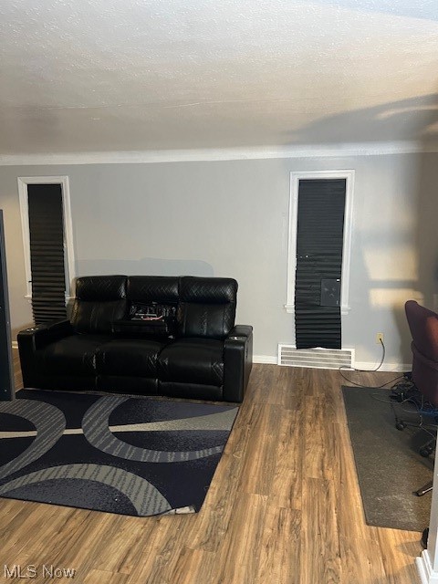 13623 Thraves Road Garfield Heights, OH 44125 - Photo 21 of 23 Living room with hardwood / wood-style floors and a textured ceiling