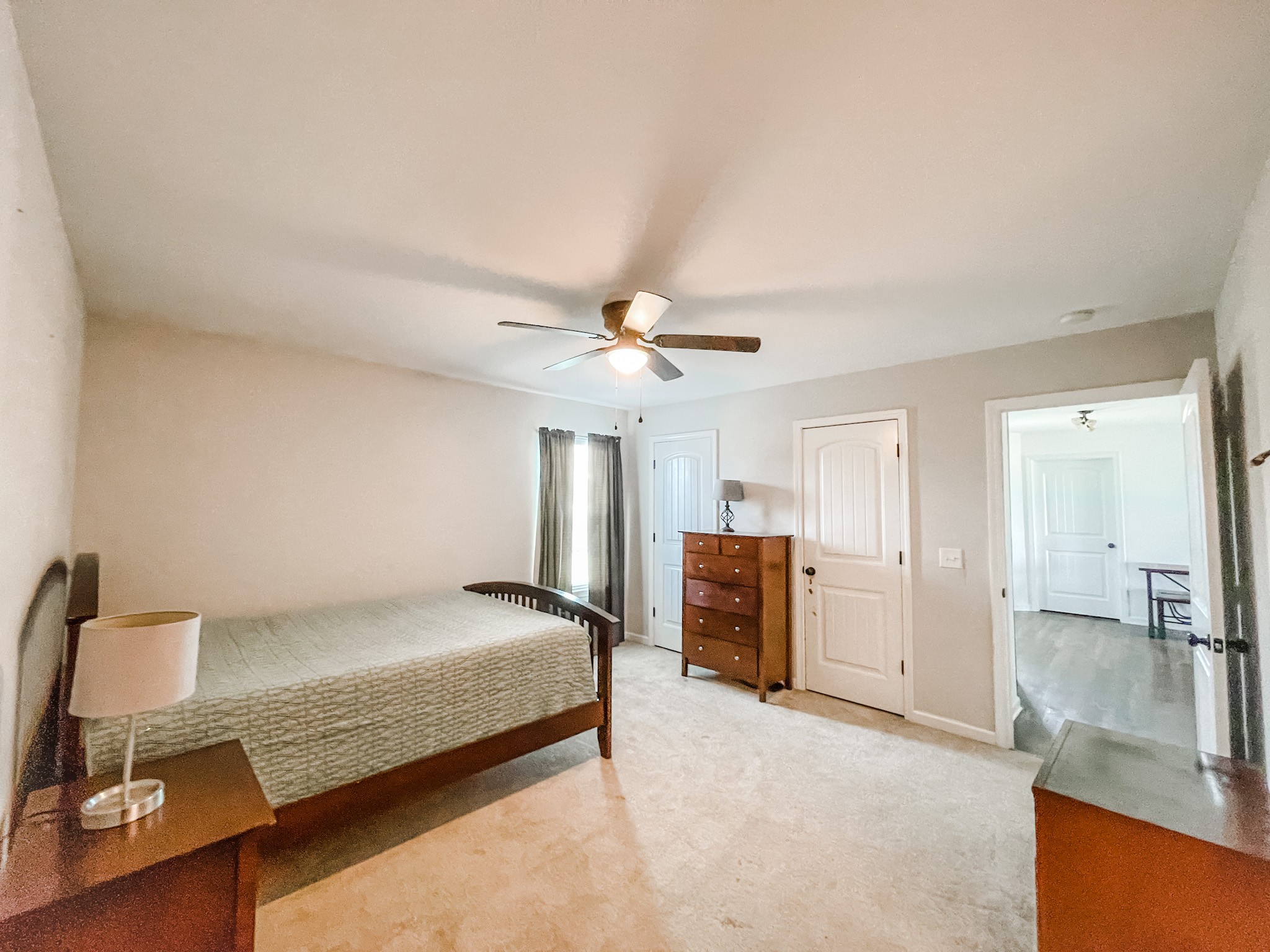 224 Shaub Road Portland, TN 37148 - Photo 12 of 23 a bedroom with a bed and a chandelier