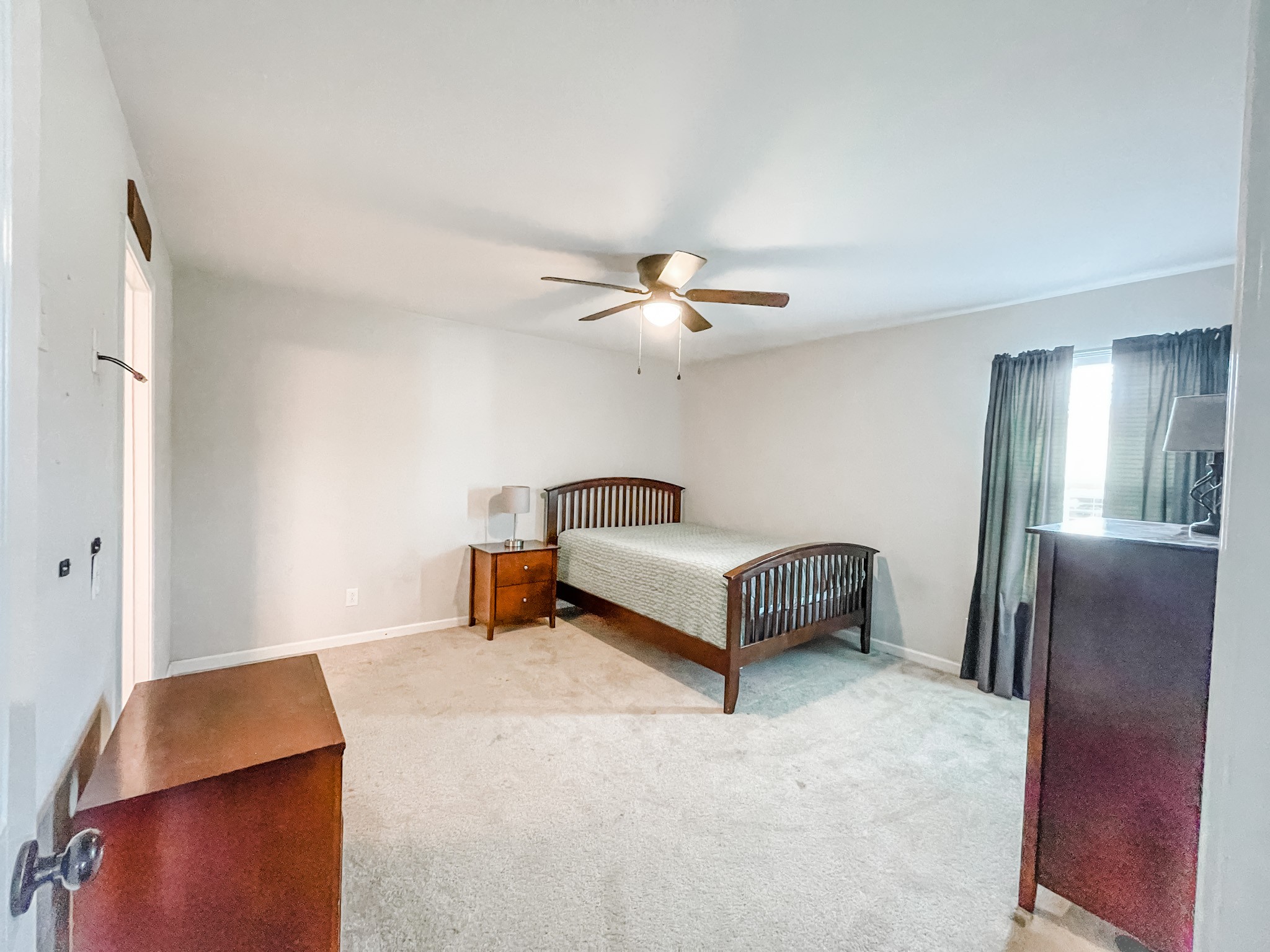 224 Shaub Road Portland, TN 37148 - Photo 13 of 23 a bedroom with a bed and a chandelier