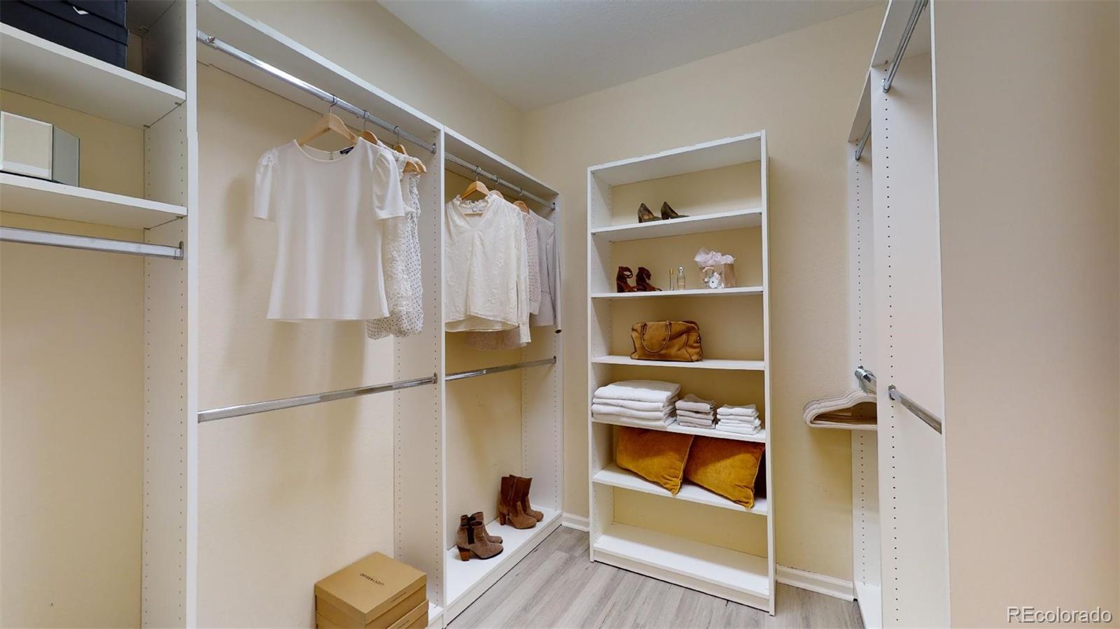 11331 Xavier Drive, Unit 103 Westminster, CO 80031 - Photo 20 of 30 a view of walk in closet with clothes and shoes