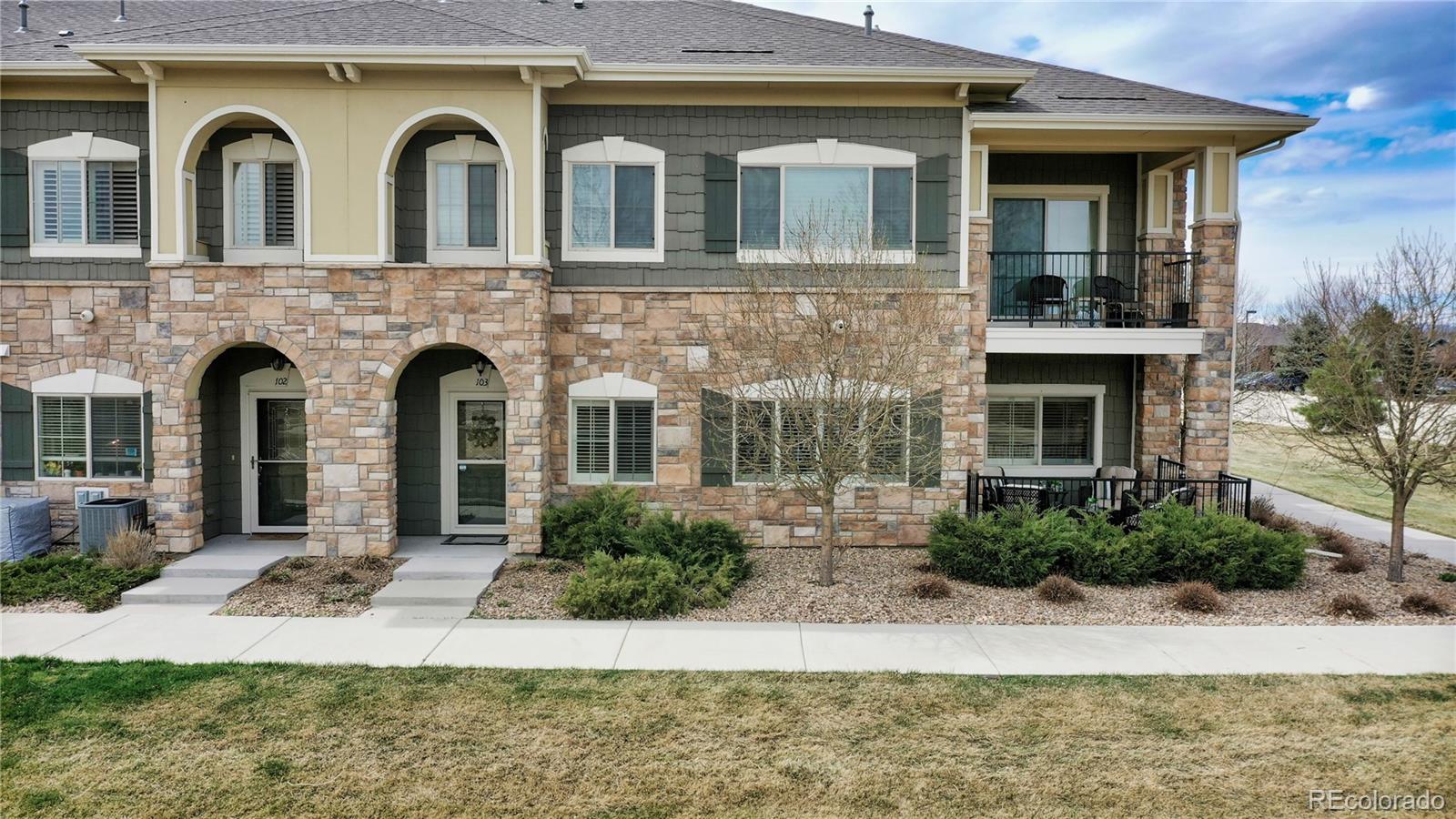 11331 Xavier Drive, Unit 103 Westminster, CO 80031 - Photo 24 of 30 a front view of a house with yard