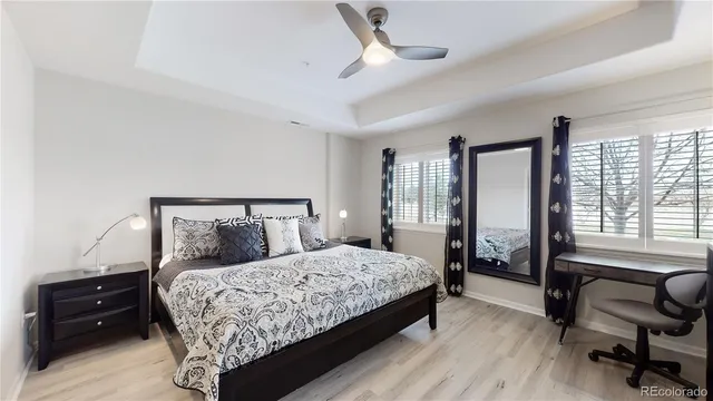 a bedroom with a bed and a couch