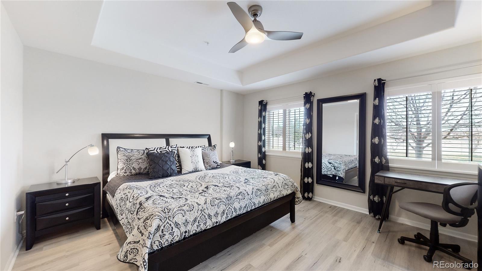 11331 Xavier Drive, Unit 103 Westminster, CO 80031 - Photo 5 of 30 a bedroom with a bed and a couch