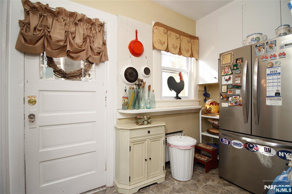 301 3rd Street Clifton, NJ 07011 - Photo 13 of 28 a bathroom with a toilet sink and mirror
