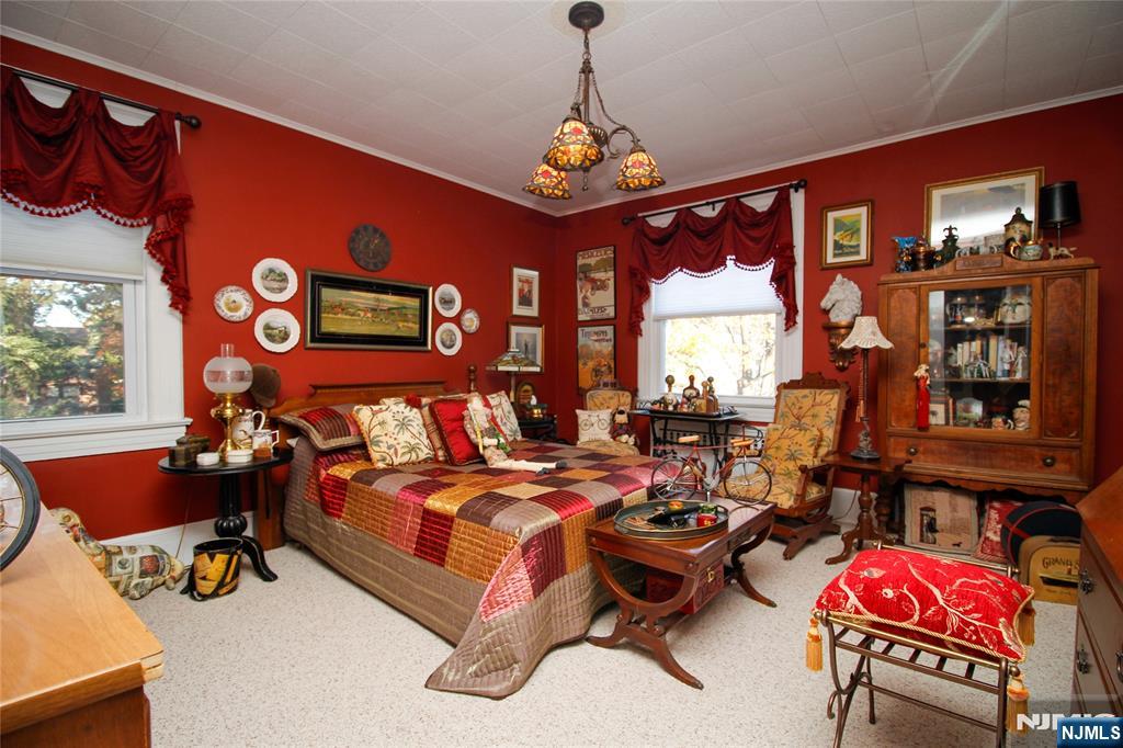 301 3rd Street Clifton, NJ 07011 - Photo 19 of 28 a bedroom with furniture and a large window