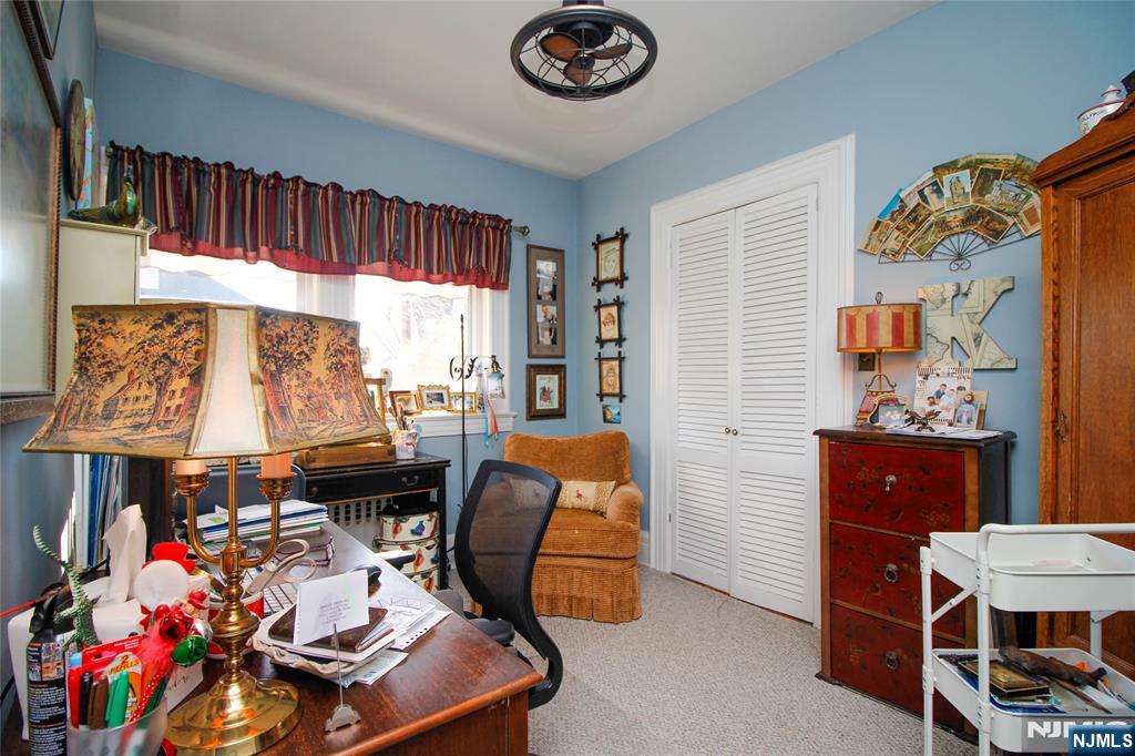 301 3rd Street Clifton, NJ 07011 - Photo 3 of 28 a room with furniture and a window