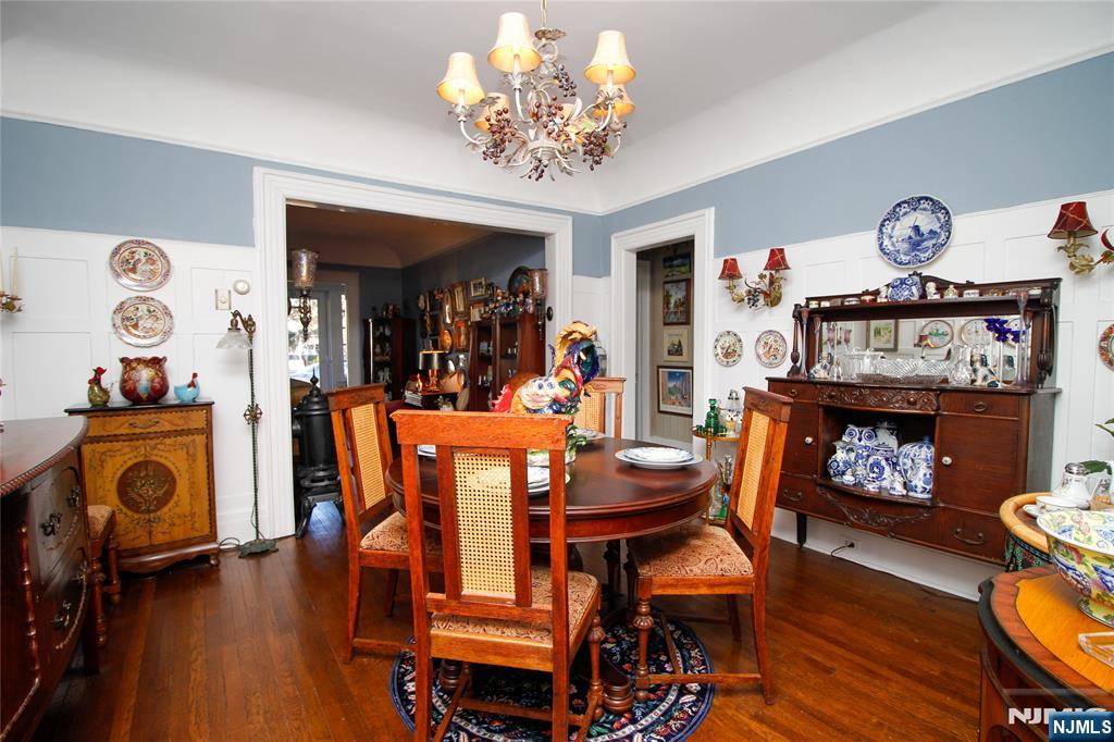 301 3rd Street Clifton, NJ 07011 - Photo 5 of 28 a dining room with furniture and wooden floor