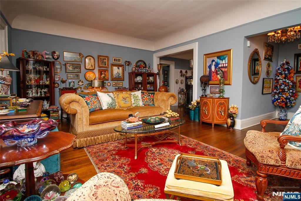 301 3rd Street Clifton, NJ 07011 - Photo 8 of 28 a living room with furniture a rug and a window