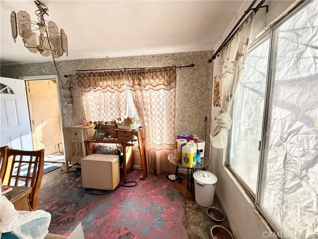 a very nice looking living room with furniture and a large window