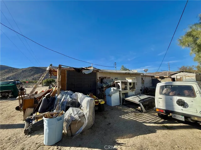 a view of a backyard with a sitting area and furniture