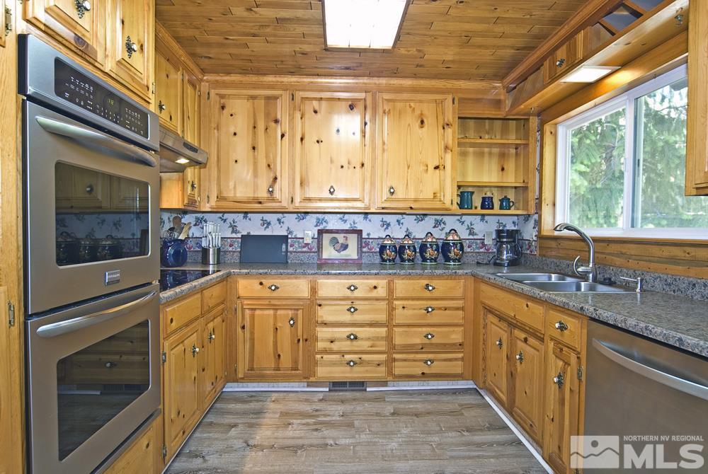 70 Pinon Road Markleeville, CA 96120 - Photo 12 of 25 a kitchen with stainless steel appliances granite countertop a stove and cabinets