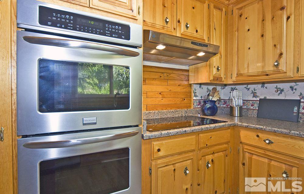 70 Pinon Road Markleeville, CA 96120 - Photo 13 of 25 a kitchen with a stove and a microwave