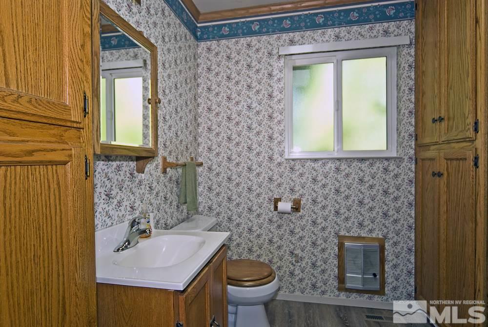 70 Pinon Road Markleeville, CA 96120 - Photo 21 of 25 a bathroom with a sink a toilet and mirror