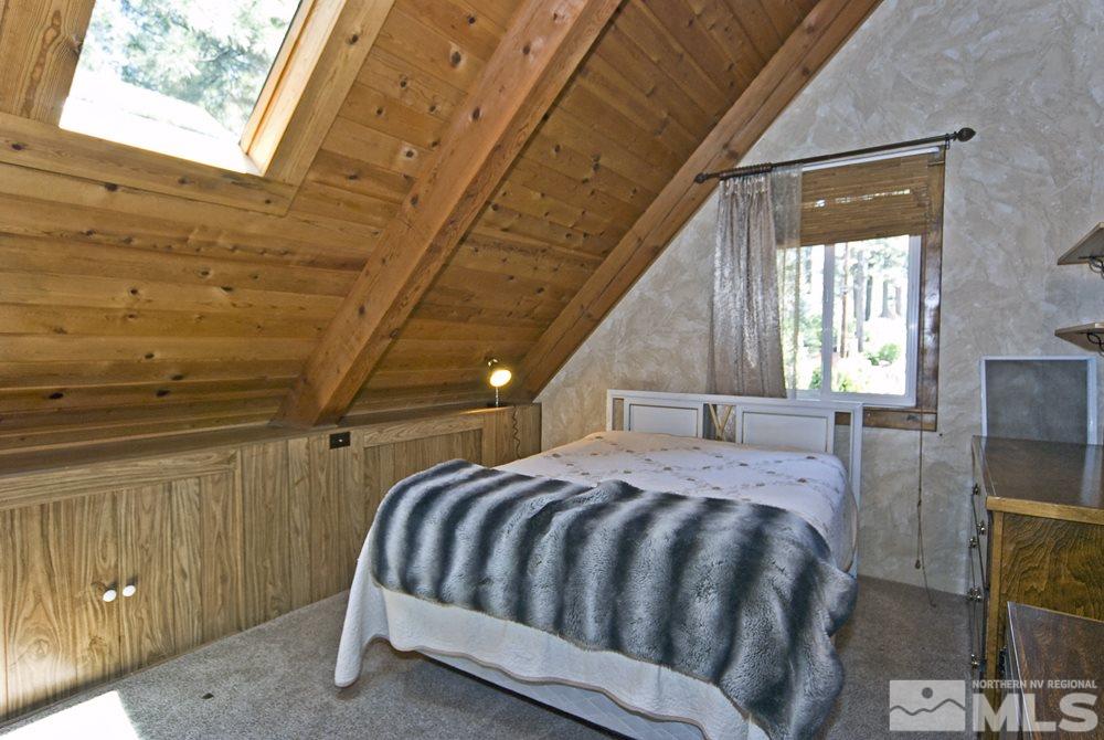 70 Pinon Road Markleeville, CA 96120 - Photo 22 of 25 a bed sitting in a room next to a window