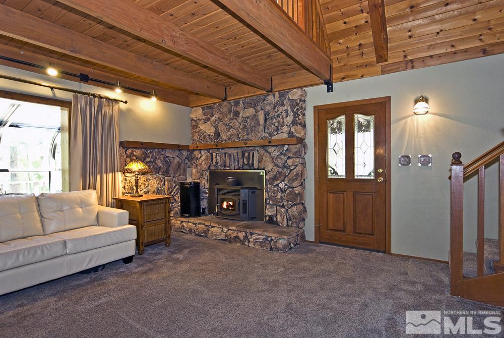 70 Pinon Road Markleeville, CA 96120 - Photo 10 of 25 a living room with furniture and a fireplace